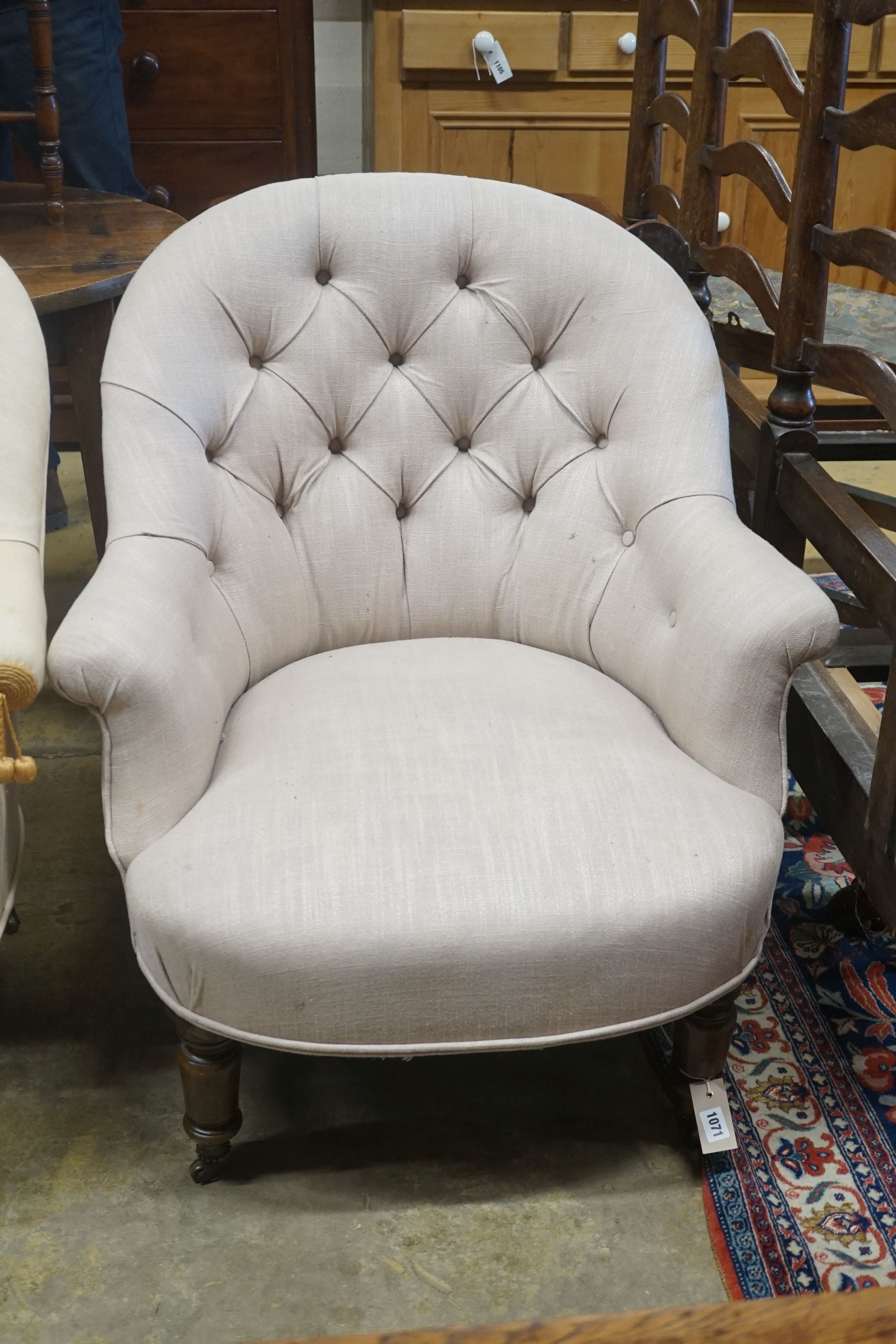 A pair of Victorian upholstered button back tub framed chairs